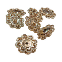 Promotional top quality owen designer design golden flower shape fancy buttons for clothes